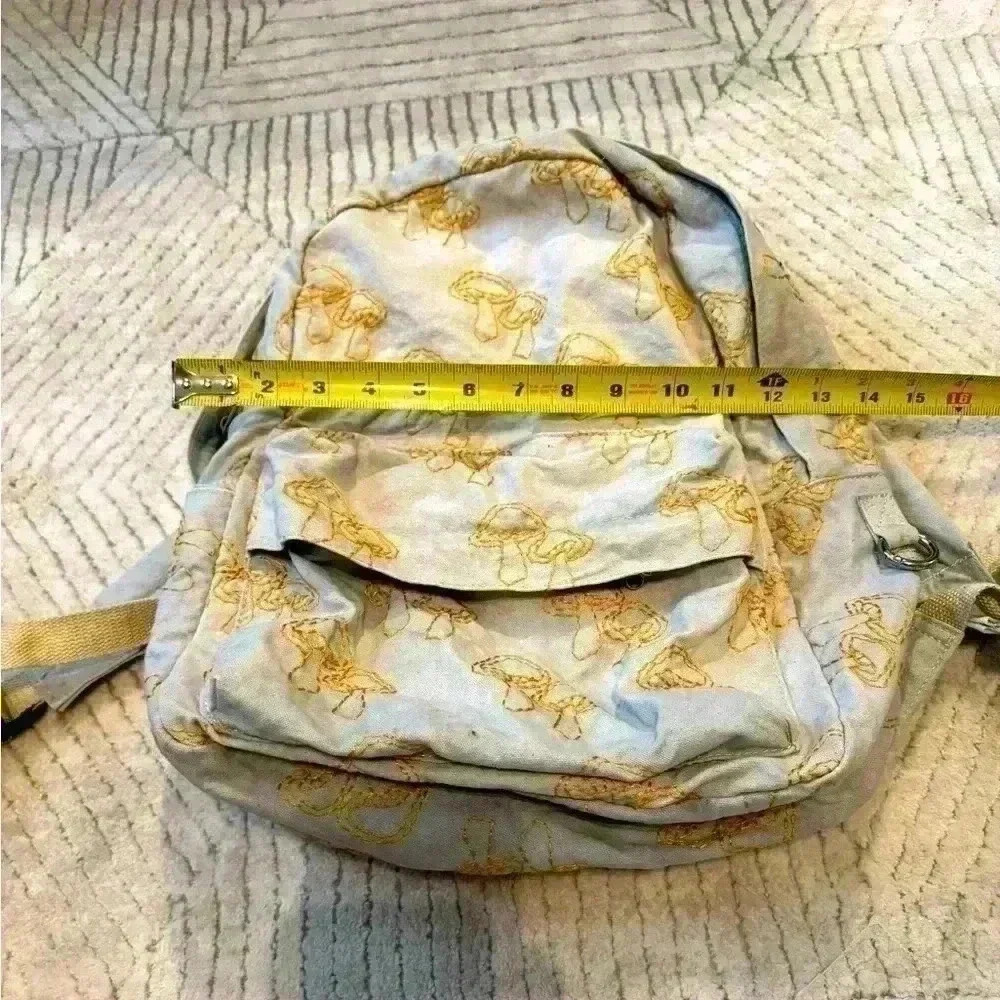 Urban outfitters embroidered gold mushroom backpack